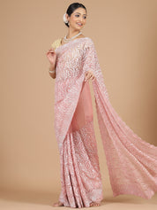 Exquisite Peach Net Saree with Stone-Studded Floral Work