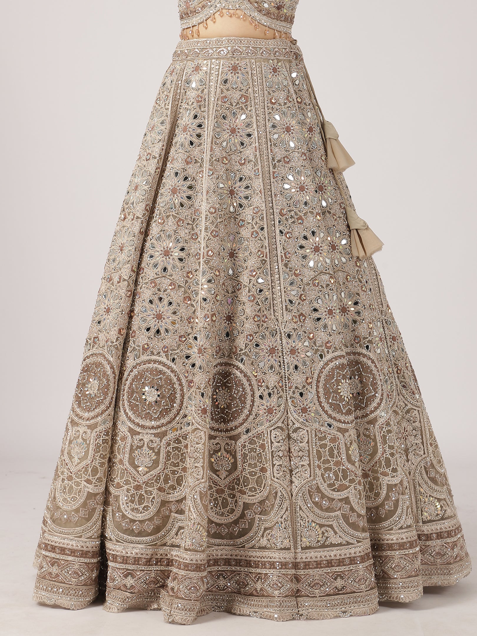 Elegant Beige Netted Lehenga with Intricate Mirror Work Blouse & Skirt