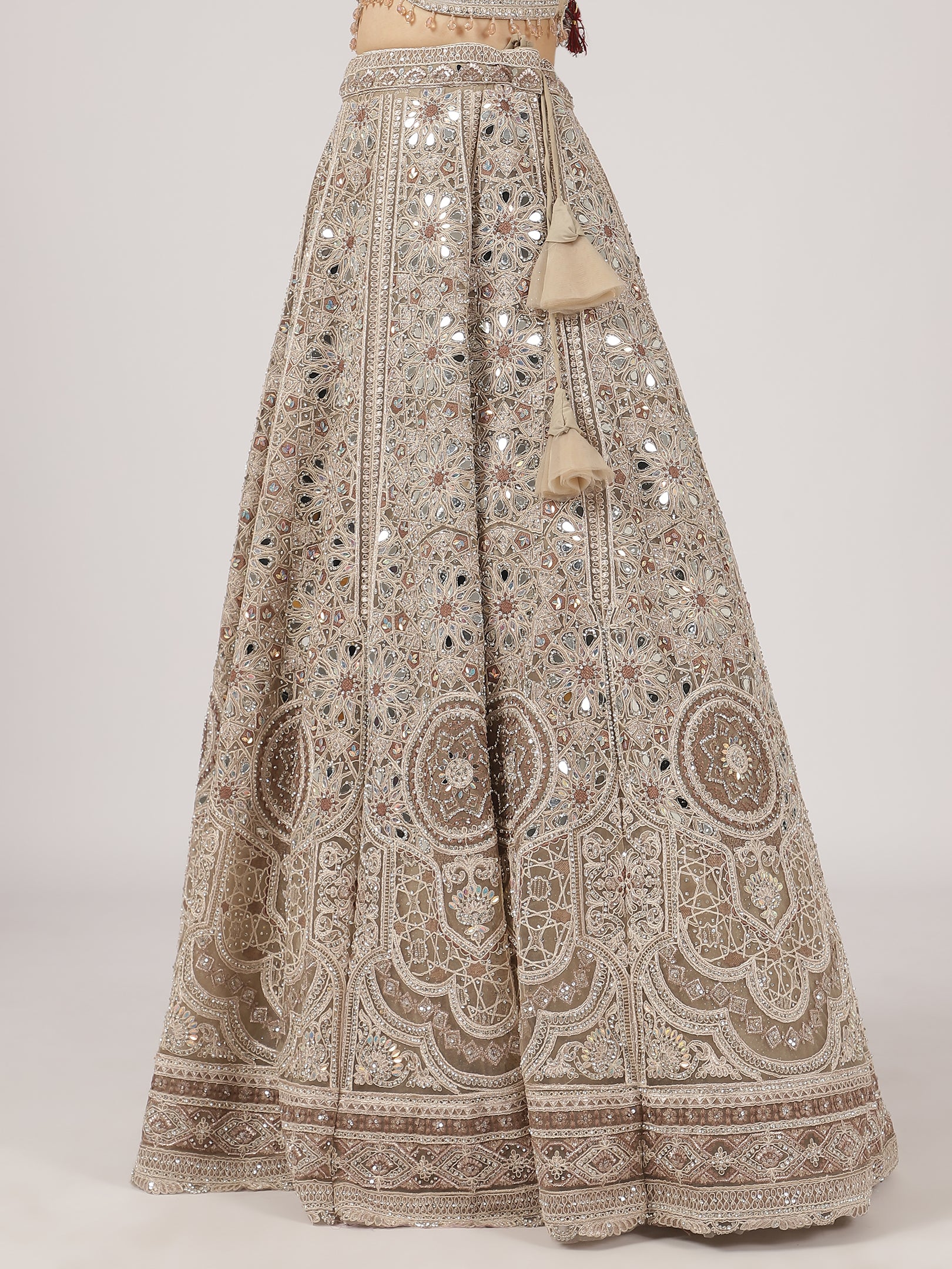 Elegant Beige Netted Lehenga with Intricate Mirror Work Blouse & Skirt