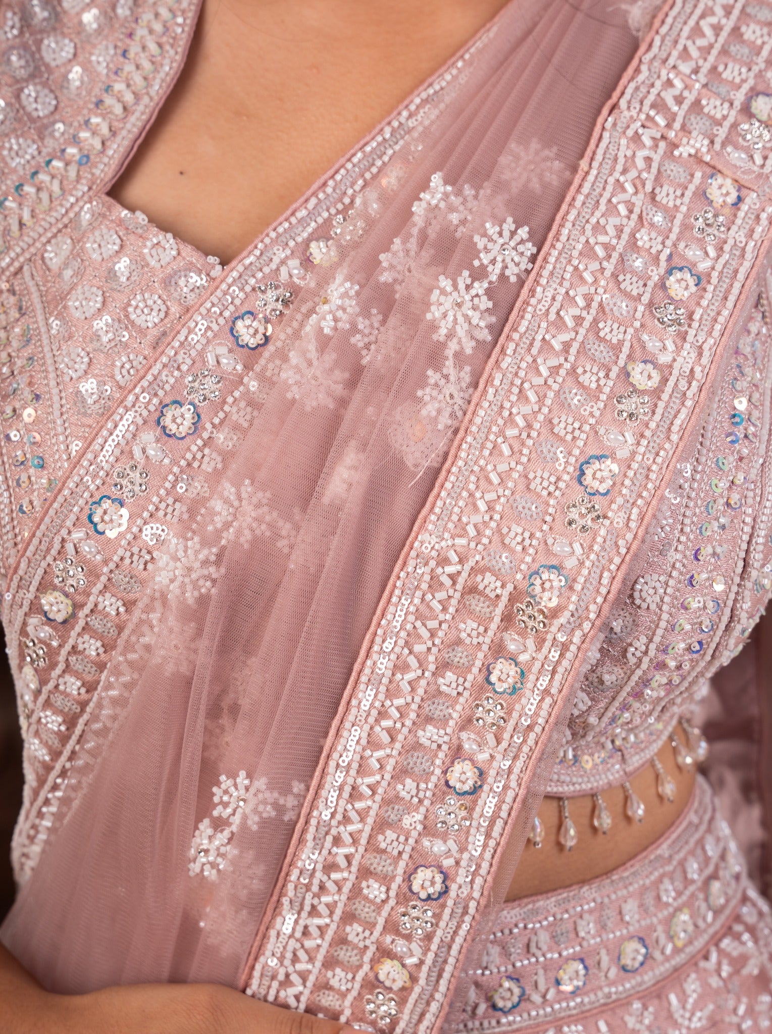 Detail of the scalloped sequin border on the blush pink net dupatta and blouse neckline