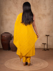 Back view of a yellow cotton salwar suit with the dupatta draped across the back