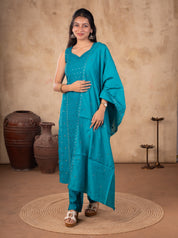 Full-length view of a Rama teal cotton salwar suit with the dupatta draped over the shoulder