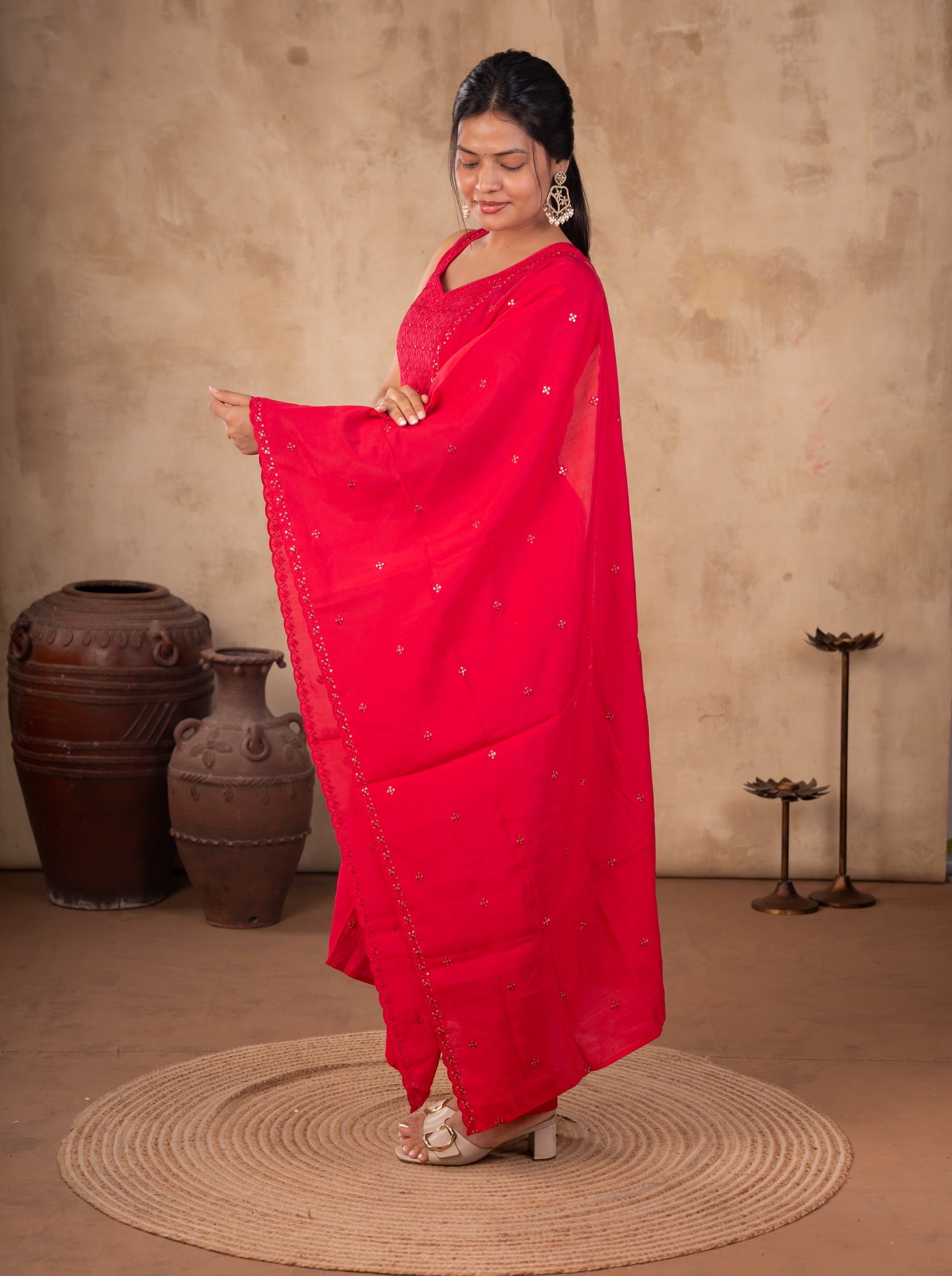 Model holding out the Rani pink dupatta over a cotton salwar suit