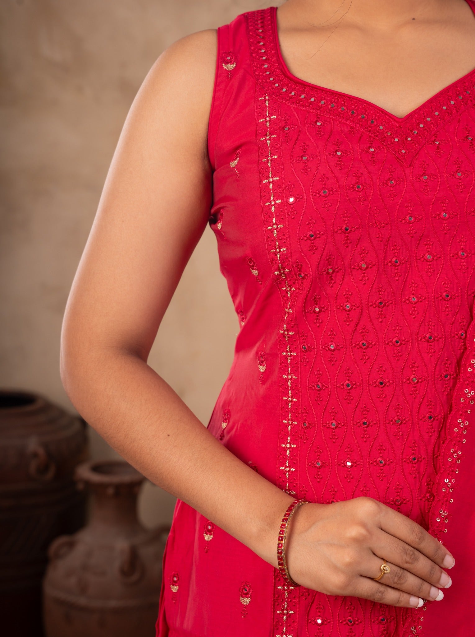 Detail of the embroidered neckline and sequin work on the Rani pink cotton kurta