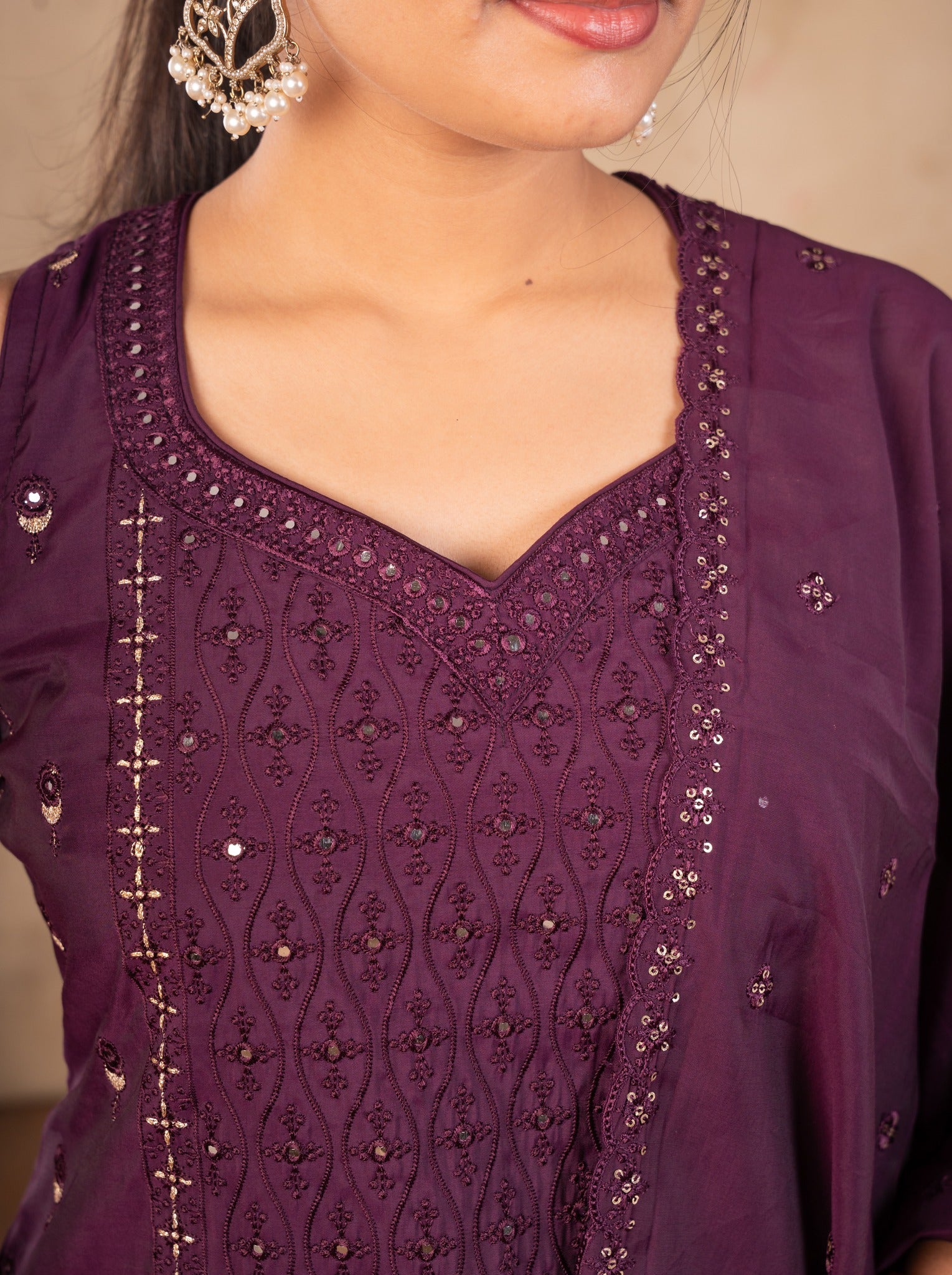 Detail of the sweetheart neckline with sequin and thread embroidery on the purple cotton kurta