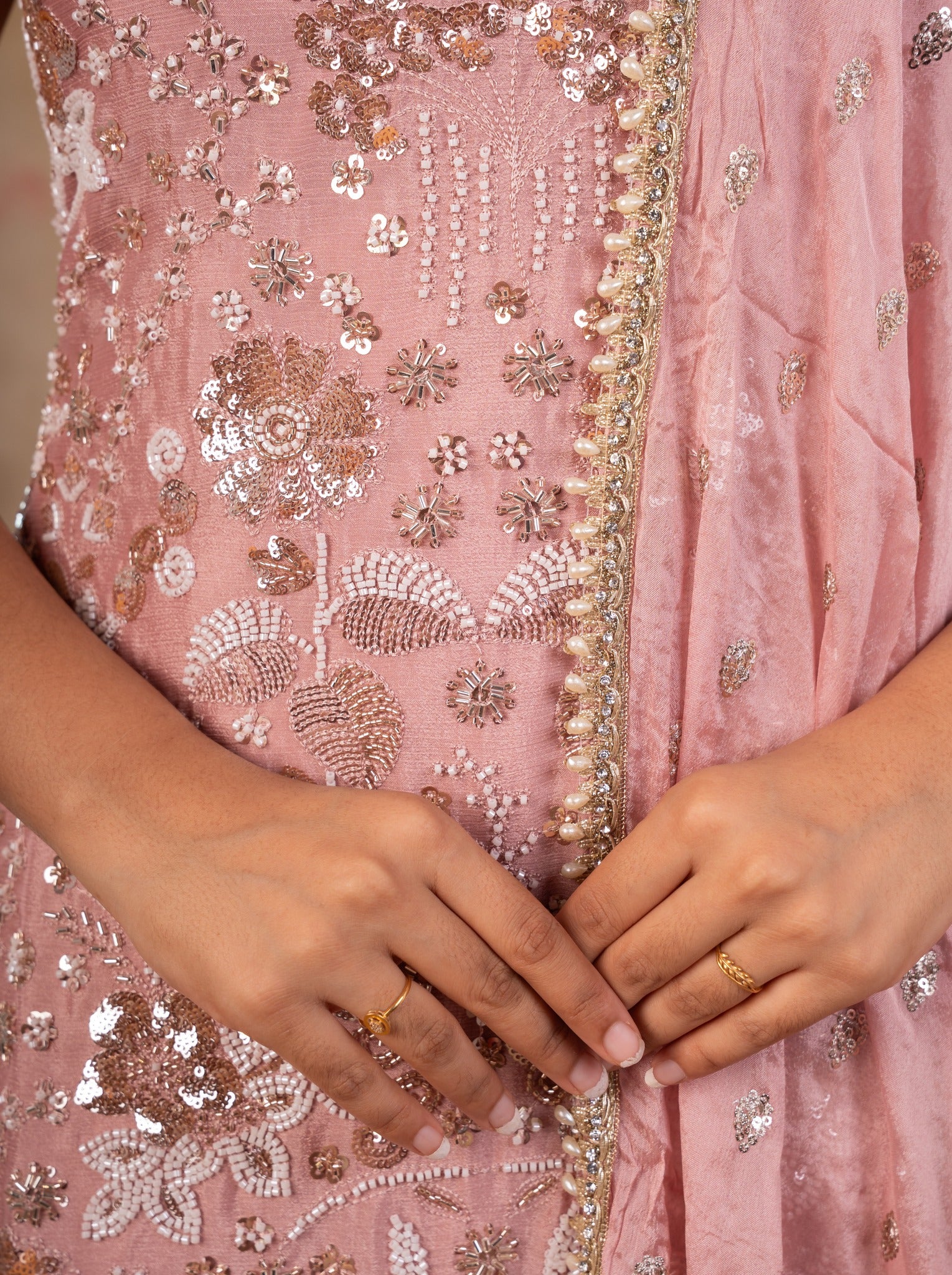 Detail of the sequin embroidery and beaded edging on the peach silk kurta