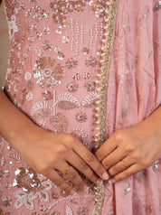 Detail of the sequin embroidery and beaded edging on the peach silk kurta