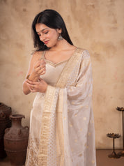 Half-length view of a white silk kurta with an embellished neckline and gold-bordered dupatta