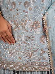 Detail of the floral sequin and thread embroidery on the sage green georgette kurta