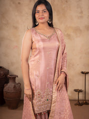 Half-length view of a sleeveless blush pink kurta with embroidery at the hem and a bordered dupatta