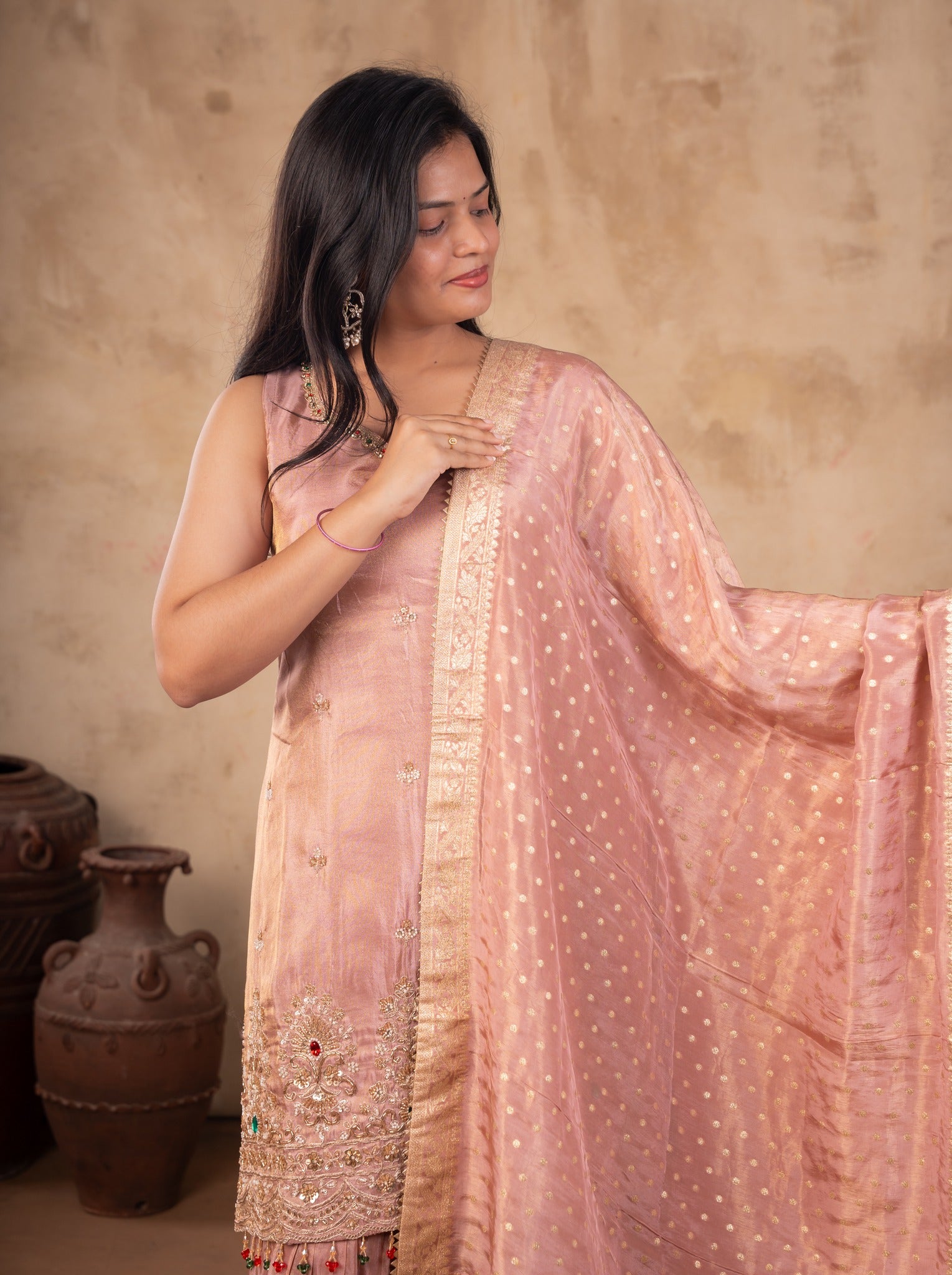 Model holding the blush pink dupatta out to the side, showing the embroidered kurta