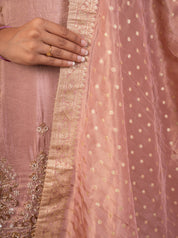 Detail of the dotted weave and gold lace border on the blush pink dupatta