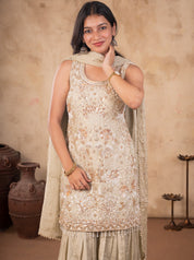 Half-length view of a light olive green kurta with floral sequin embroidery and dupatta over the shoulder