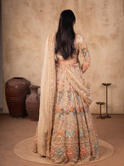 Back view of a pista organza lehenga showing the blouse back and the dupatta with ornate trim