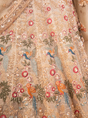 Detail of the multicoloured floral and bird embroidery on the pista organza lehenga skirt