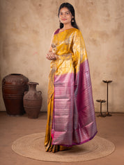 Full-length view of a mustard soft silk saree with a contrast pink and silver border