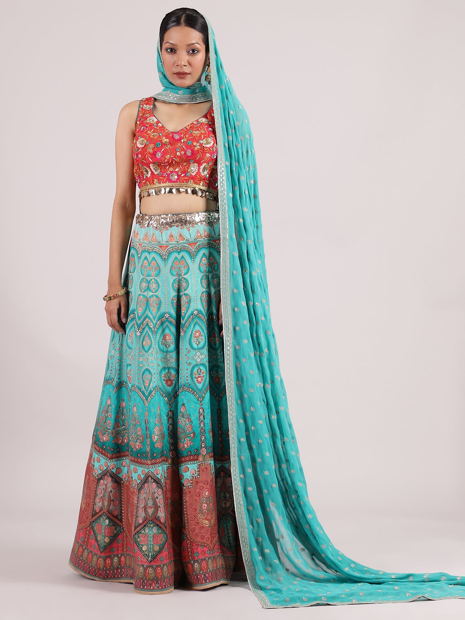 Stunning Turquoise Blue Banarasi Lehenga with Contrast Orange Embroidered Blouse