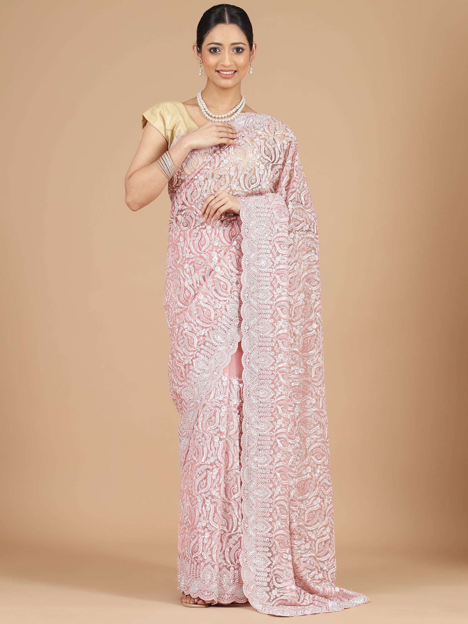 Exquisite Peach Net Saree with Stone-Studded Floral Work