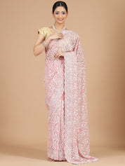 Exquisite Peach Net Saree with Stone-Studded Floral Work