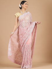 Exquisite Peach Net Saree with Stone-Studded Floral Work