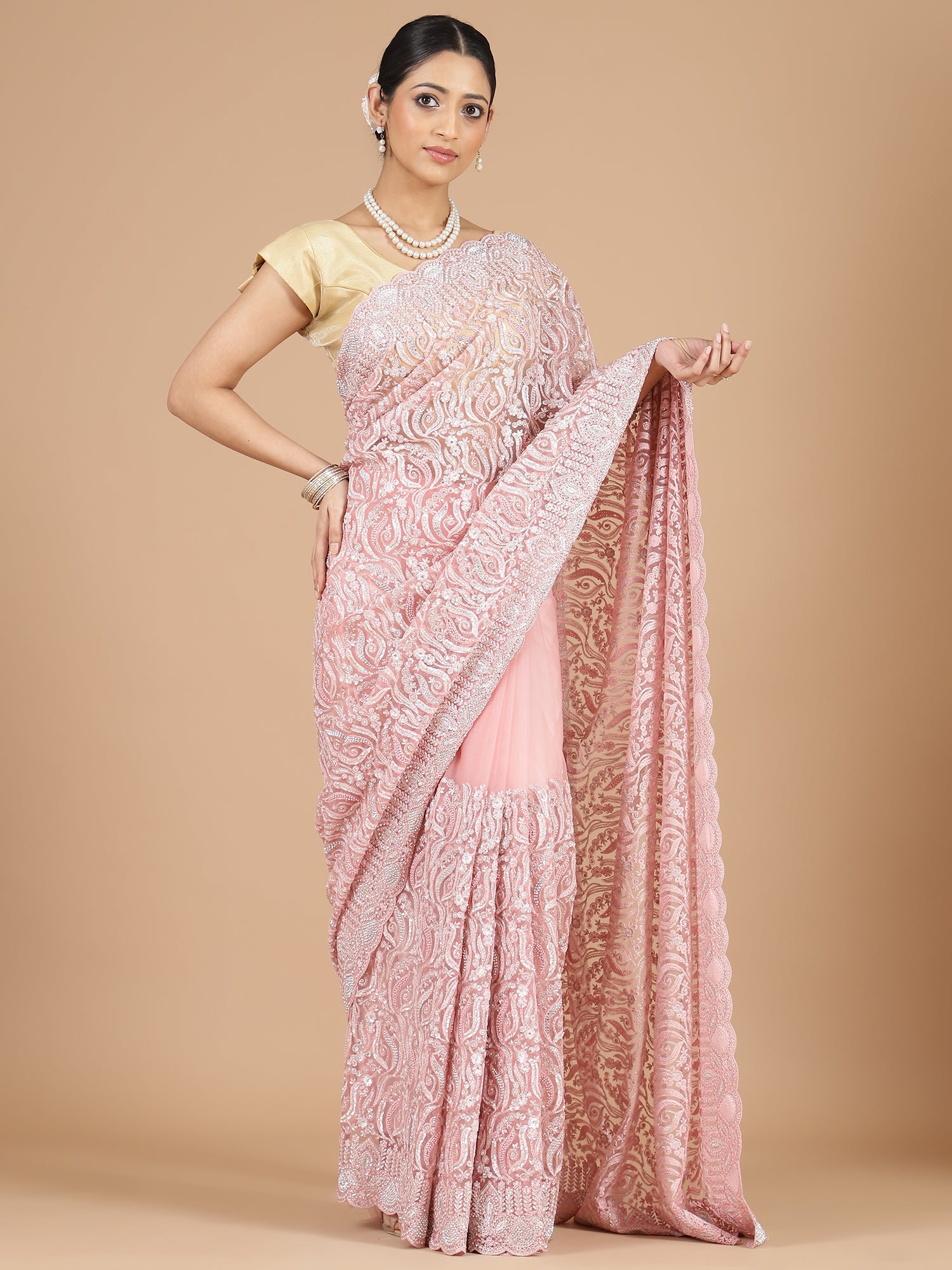 Exquisite Peach Net Saree with Stone-Studded Floral Work