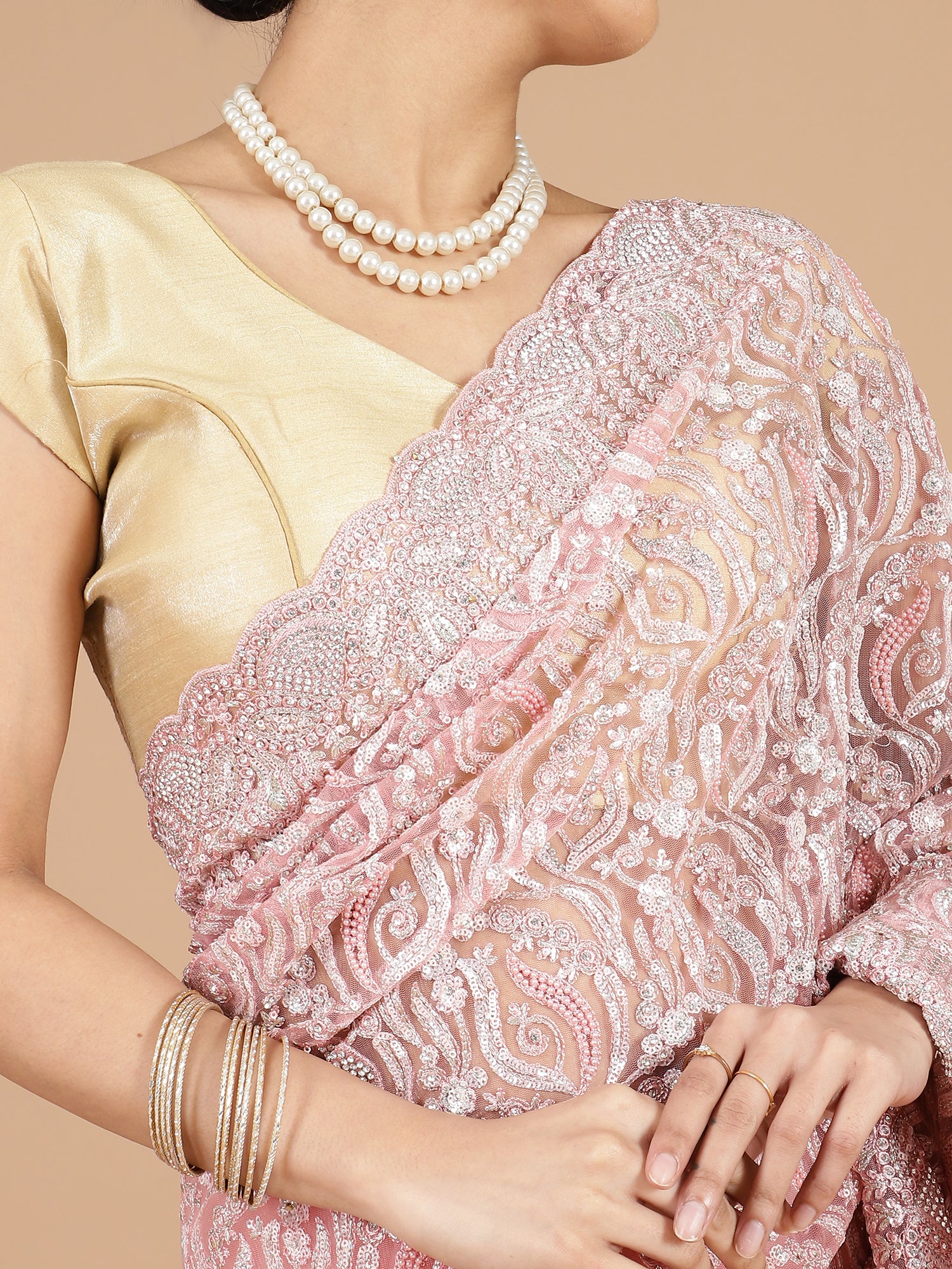 Exquisite Peach Net Saree with Stone-Studded Floral Work