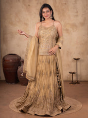 Model wearing a pista organza lehenga with a pleated, embroidered skirt, a matching strappy choli, and a sheer dupatta with an ornate border.